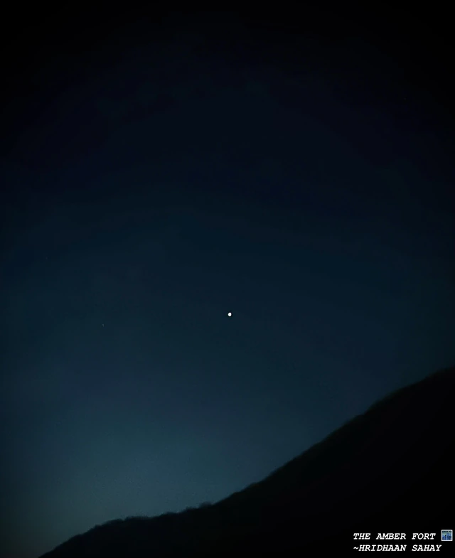 One bright point of light above the hills at Amer Fort.